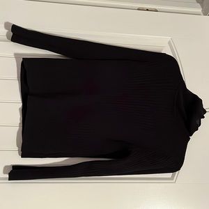 Woman’s black turtleneck